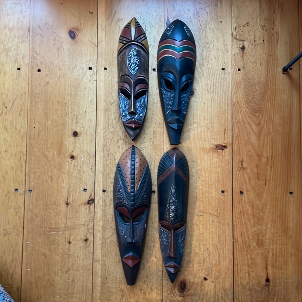 4 handmade, wooden, African masks